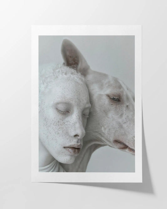 Fine art print featuring an ethereal portrait of an albino human and an albino animal in soft pale tones, printed on Hahnemühle Photo Rag paper for a high-quality matte finish, celebrating unique beauty and connection.